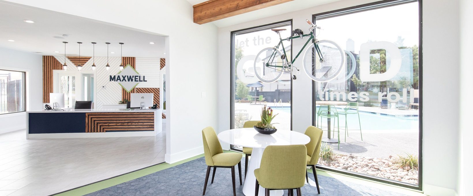 a dining room with a table and chairs and a bicycle at The Maxwell