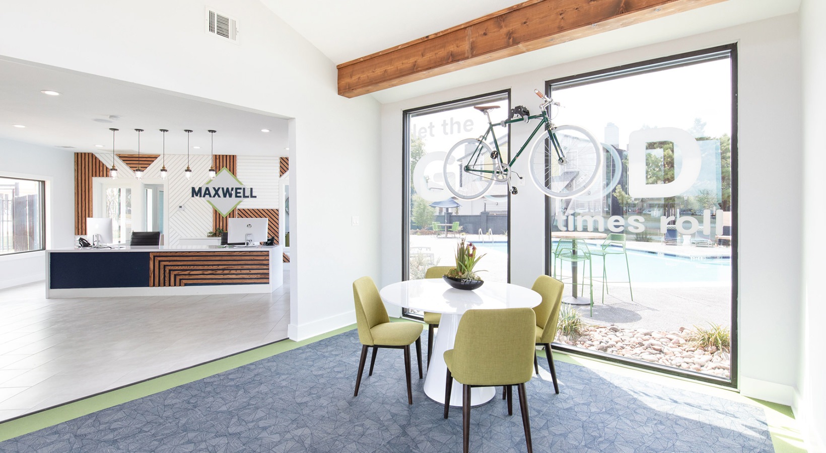 a dining room with a table and chairs and a bicycle at The Maxwell